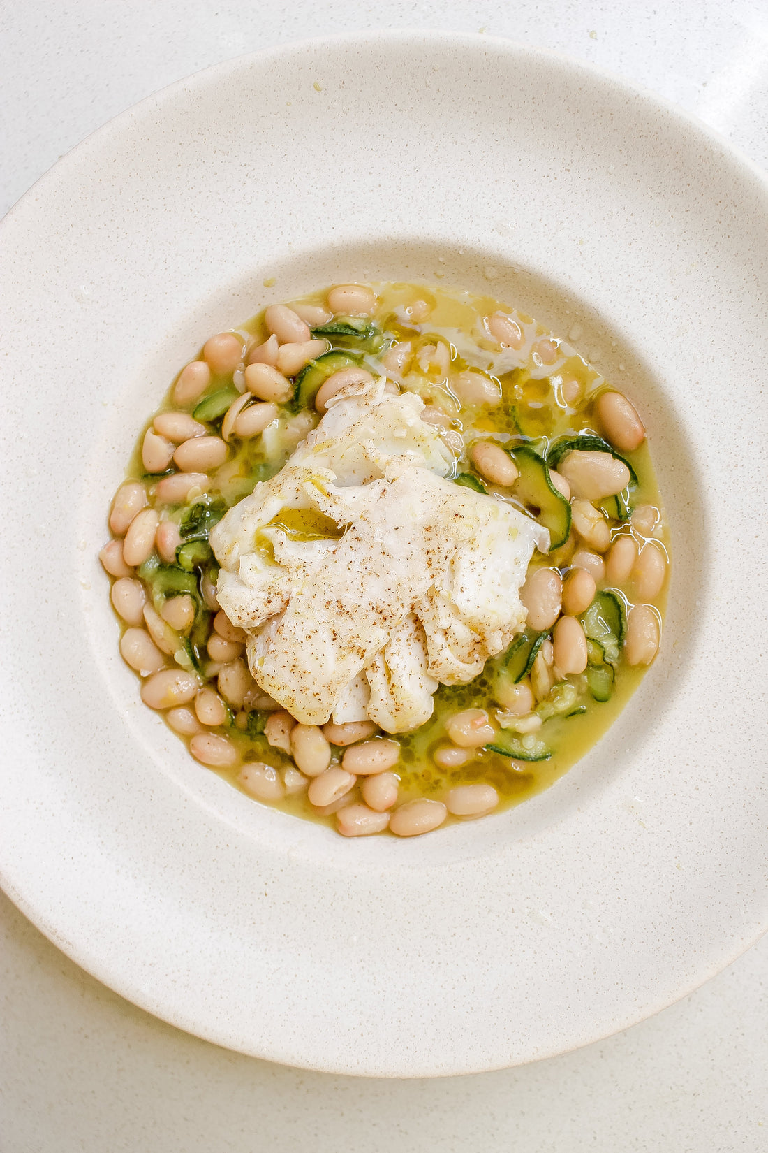 Creamy cod + zucchini beans